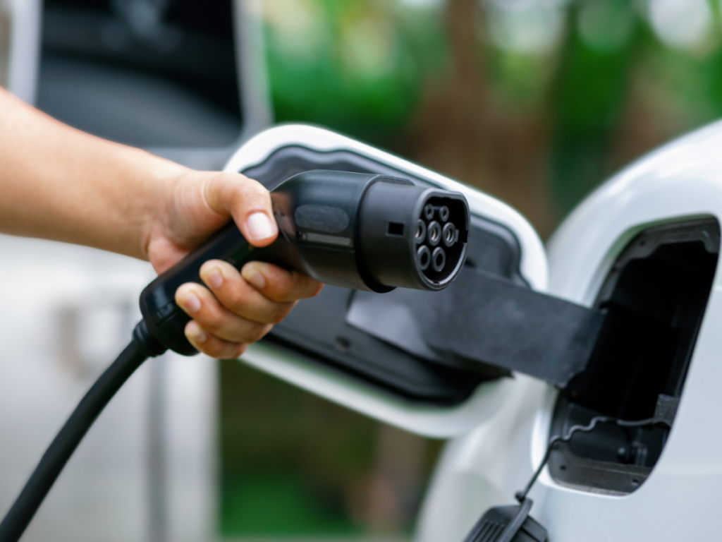 Homeowner charging car with home EV charger
